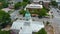 orbit aerial footage of the blue dome on top of Athens City Hall surrounded by office buildings, churches, apartments