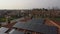 Orbital aerial shot of technician maintenance of photovoltaic panel on home roof top