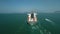 Orbiting the back of a huge cargo ship vessel in the ocean aerial footage