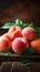 Orchard harvest Ripe peaches with leaves on a wooden backdrop