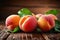 Orchard harvest Ripe peaches with leaves on a wooden backdrop