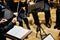 Orchestra conductor from behind directing his musicians during a concert