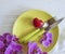 orchid flower plate, heart, fork knife serving concept on a wooden background