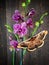 Orchid gorgeous purple spotty flowers and butterfly against old wooden background. Moth Saturnia pyri and Tiger orchid.