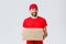 Order delivery, online shopping and package shipping concept. Friendly smiling courier in red uniform cap and t-shirt