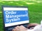 Order Management System OMS is shown on the conceptual business photo