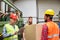 Order picker and warehouse worker with a package