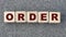 ORDER - word on wooden cubes on a gray background