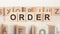 ORDER - word on wooden cubes on white background