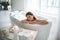 Orderly woman having leisure in bath indoor