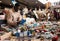 Ordinary Afro-American guy considers things sacond hands on flea market