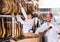 Ordinary Butchery technologists checking joints of iberico jamon