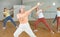 Ordinary females exercising dance moves in dance center