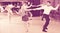 Ordinary group people dancing lindy hop in pairs