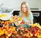 Ordinary long-haired girl cooking fruit salad