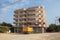 Ordinary residential building in Turkey, yellow truck parked near the house