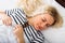 Ordinary young woman taking nap in bedroom