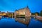 Orebro Castle reflecting in water in the evening, Sweden