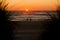 Oregon coast beach with a magnificent sunset and people taking a stroll