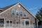 Oregon Coast typical faÃ§ades: wooden shingles, weathered, white windows. Pacific coast properties