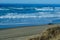 Oregon coastal scene of churning surf and beautiful beach
