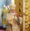 Orel, Russia, July 28, 2016: Russia Christianization anniversary Divine Liturgy. Patriarch Kirill praying in golden robe in church