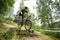 Orel, Russia, June 15, 2019: redBike Cup cross country cycle XCO competition. Sportsman crossing barrier by bike