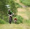 Orel, Russia, June 15, 2019: redBike Cup cross country cycle XCO competition. Sportsmen cycling hard uphill on country road