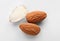 Organic almond nuts on white background, top view