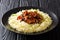 Organic Asian food glazed shiitake mushrooms with sesame seeds served with rice closeup on a plate. horizontal