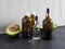Organic avocado oil in a dark glass bottle with a pipette. Serum in glass bottle with pipette on black and white background. 