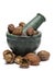 Organic Badi Harad fruit (Terminalia chebula) on marble pestle