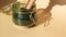 Organic blue-green algae spirulina powder food in glass jar with wooden spoon. Health benefits of spirulina chlorella