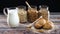 Organic breakfast supplies on the table. Fresh milk, healthy oatmeal and buns