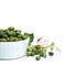 Organic capers in white bowl on white background