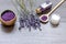 Organic cosmetics with lavender on wooden background top view