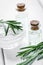 organic cosmetics with rosemary extract on wooden table backgrou