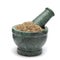 Organic Cumin seed (Cuminum cyminum) on marble pestle.