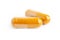 Organic curcumin or turmeric powder in capsule on white background