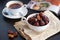 Organic Dates in white bowl with tea background, Dry dates fruit are naturally flavorful, low in fat and high in potassium