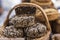 Organic farm rye bread with sunflower seeds in a basket, homemade baked in the wood stove