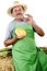 Organic farmer with a half honeydew melon