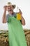 Organic farmer is holding a bottle orange juice
