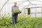 Organic Farmer Holding Tray Of Seedlings