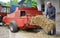 Organic farmer making/stack bales