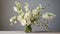 Organic And Flowing White Flower Arrangement In Vase