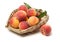 Organic food background - peach fruits with green leaves