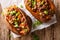 Organic food: baked sweet potato stuffed with ground beef and gr