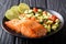 Organic food: baked wild salmon steak and fresh vegetable salad