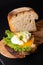 Organic Food breakfast concept homemade Poached egg or eggs benedict on sourdough bread toasted on black slate board
